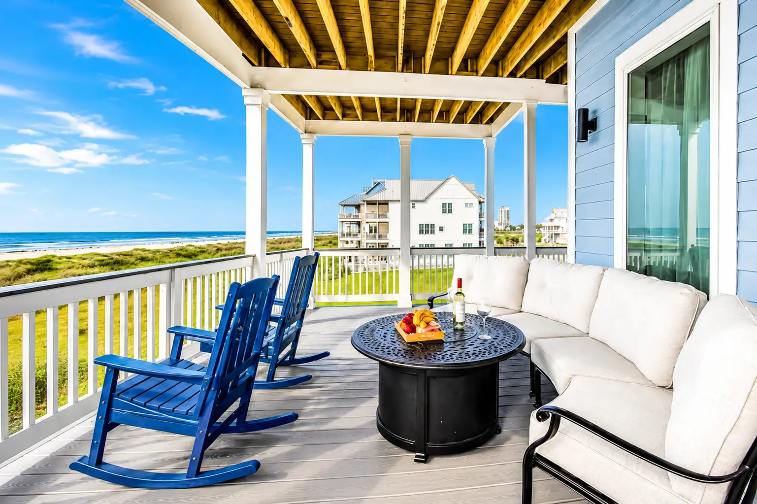 Beach chairs on the sand steps from Grand Beach Retreat